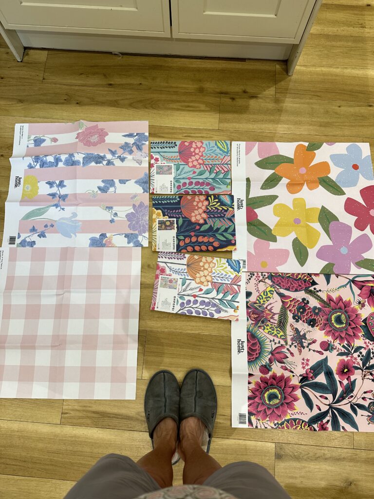 The image shows a selection of pink wallpaper samples 